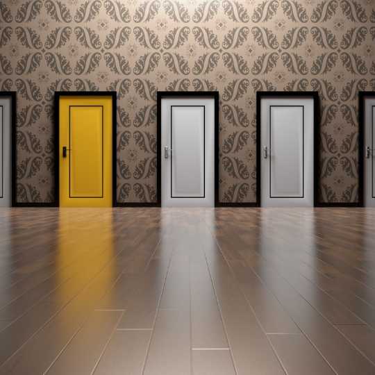 3 Several doors, one of then yellow, indicating making difficult leadership choices